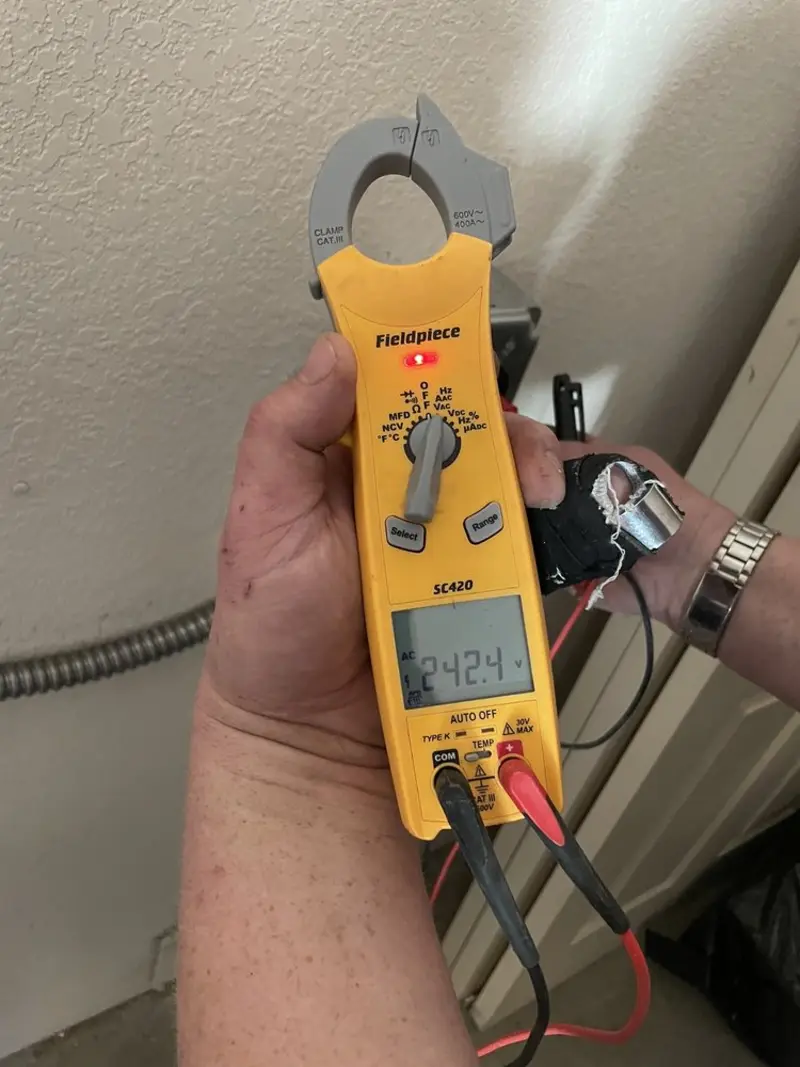 Voltage testing with clamp meter during Outlet Installation in Odenton